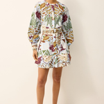 Woman wearing a floral dress on a white background