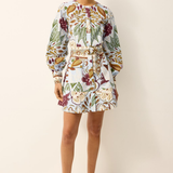 Woman wearing a floral dress on a white background