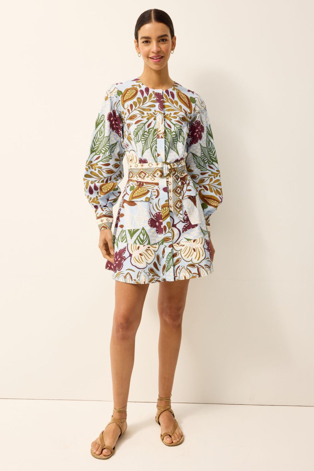 Woman wearing a floral dress on a white background