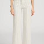 woman in stripe pants and white background 