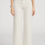 woman in stripe pants and white background 