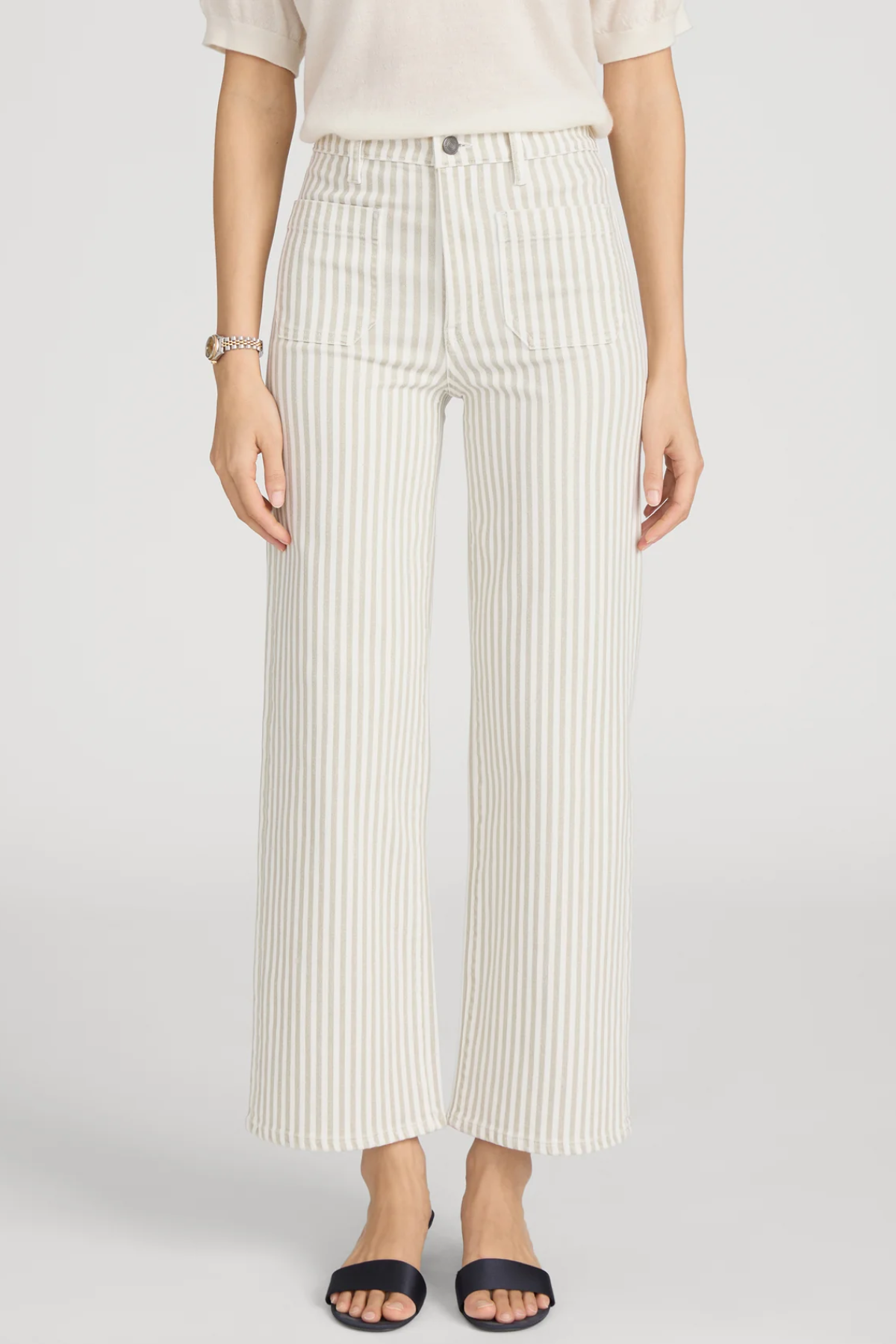 woman in stripe pants and white background 