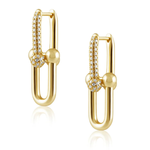 A pair of gold huggie hoop earrings with pavé-set clear stones and polished gold bead accents, displayed on a clean white background with a soft reflection.