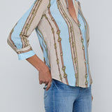 Three-quarter sleeve blouse with a soft stripe pattern.