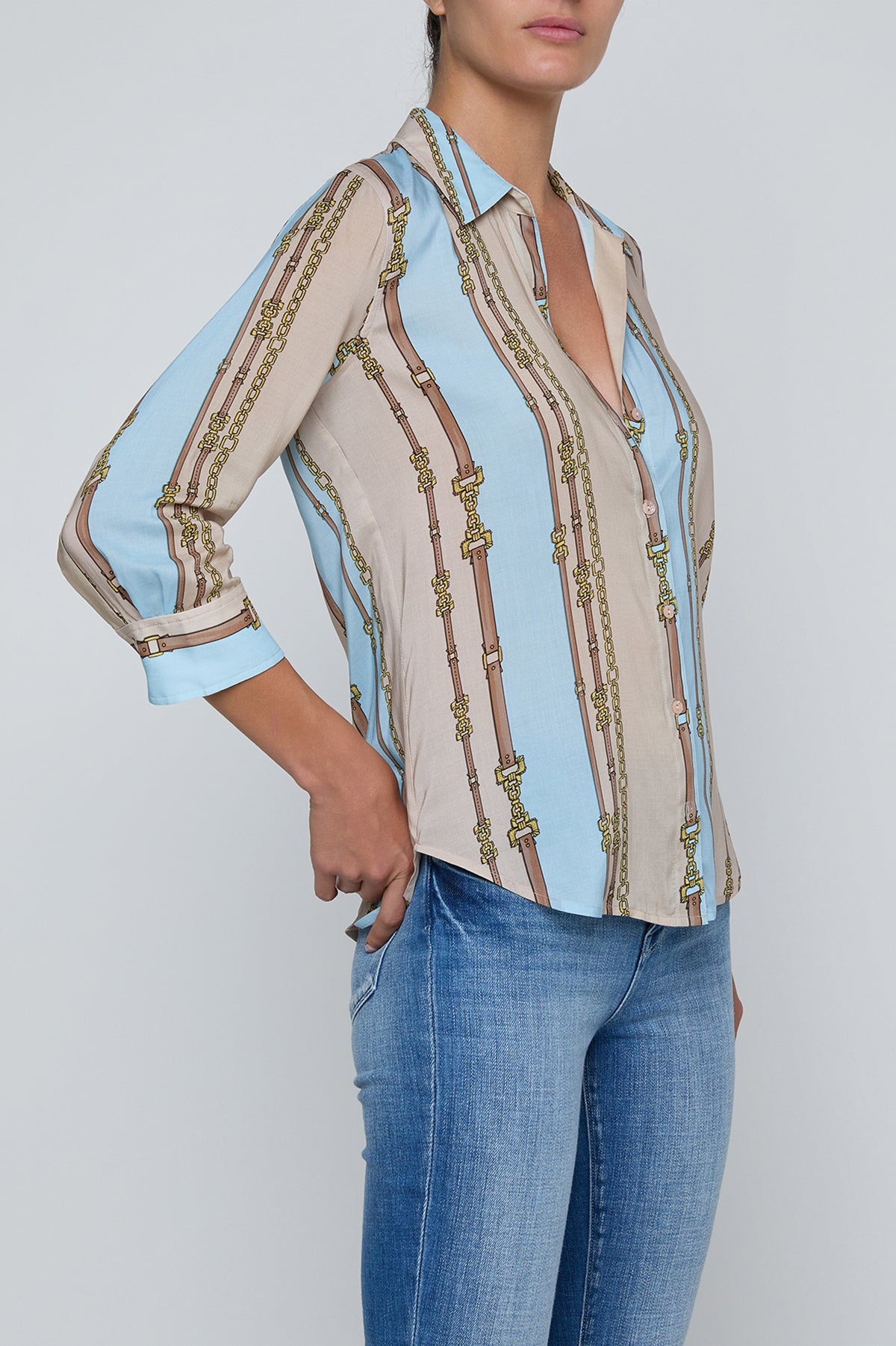 Three-quarter sleeve blouse with a soft stripe pattern.