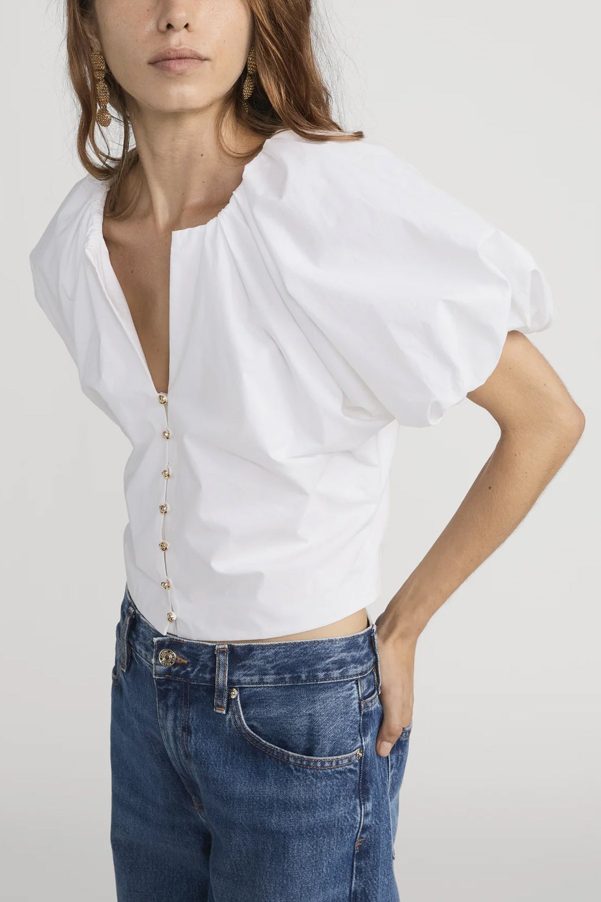 Blouse with dramatic voluminous sleeves styled with denim