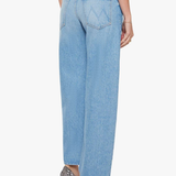 Light blue jeans worn by a person on a white background
