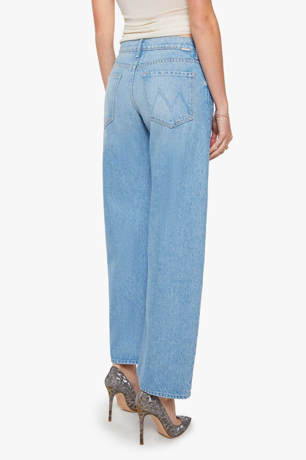 Light blue jeans worn by a person on a white background