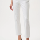Person wearing white pants on a plain background