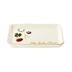 An off-white ceramic lucky tray with a gold rim, featuring small decorative charms including a green four-leaf clover, a blue and white evil eye, a red ladybug, and a white cat. The bottom right corner is inscribed with 'My Lucky Charm' in gold script.