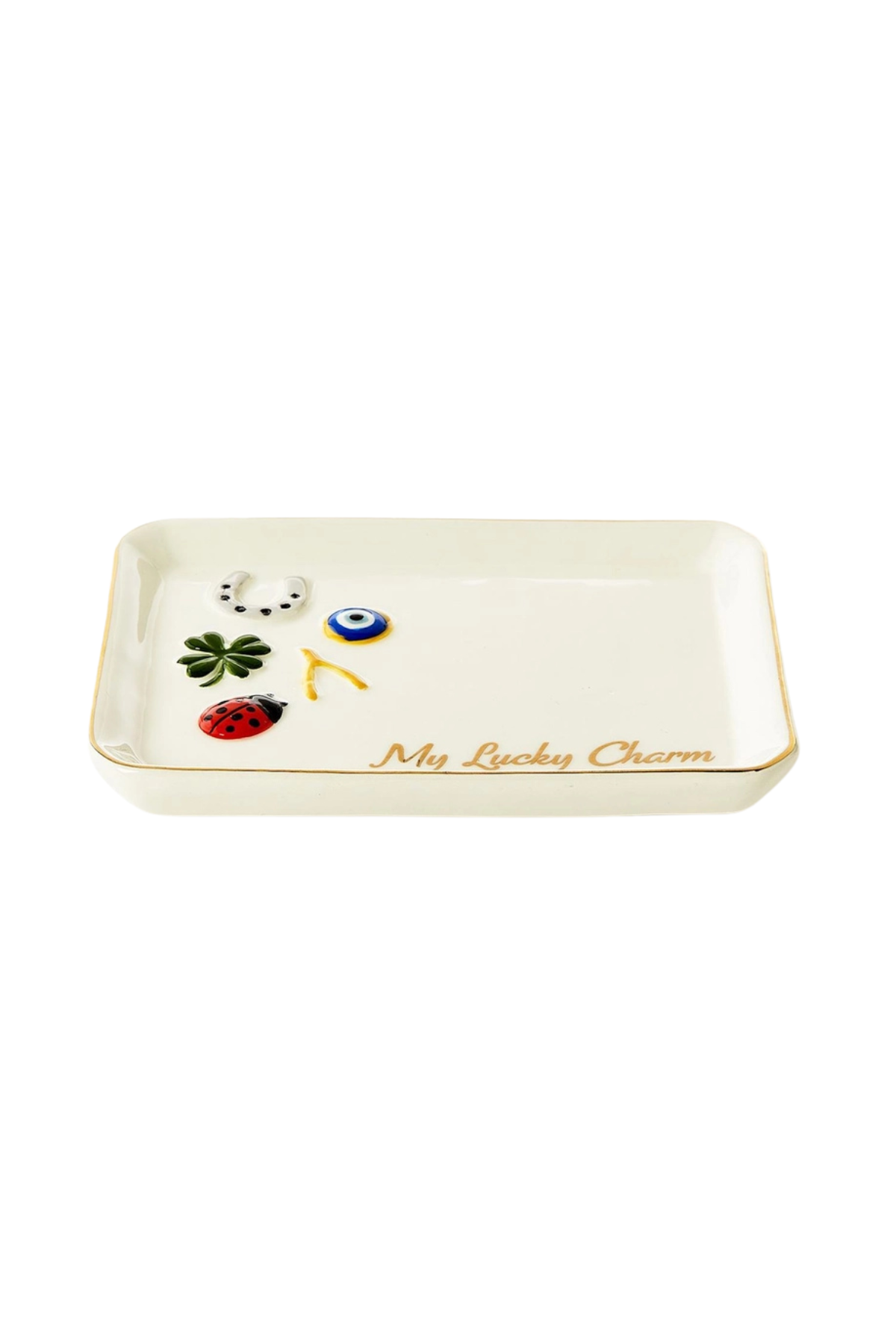 An off-white ceramic lucky tray with a gold rim, featuring small decorative charms including a green four-leaf clover, a blue and white evil eye, a red ladybug, and a white cat. The bottom right corner is inscribed with 'My Lucky Charm' in gold script.