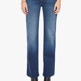 A model from the waist down wearing medium wash blue denim jeans with a straight-leg fit, paired with black pointed-toe ankle boots against a plain white studio background.