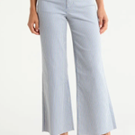 Blue and white striped wide-leg pants worn by a person on a white background