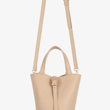 tan mini tote with crossbody strap on white background 