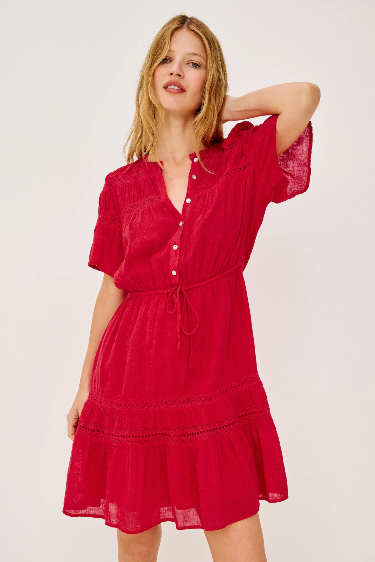 Woman wearing a red dress on a white background
