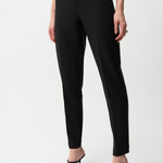 Black pants worn by a person on a white background