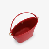 Red handbag with a handle on a white background