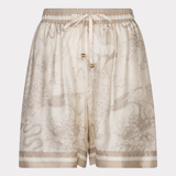 Beige shorts with a subtle pattern on a white background