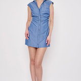 Model wearing a sleeveless striped mini dress with a relaxed fit and classic blue-and-white stripe pattern.