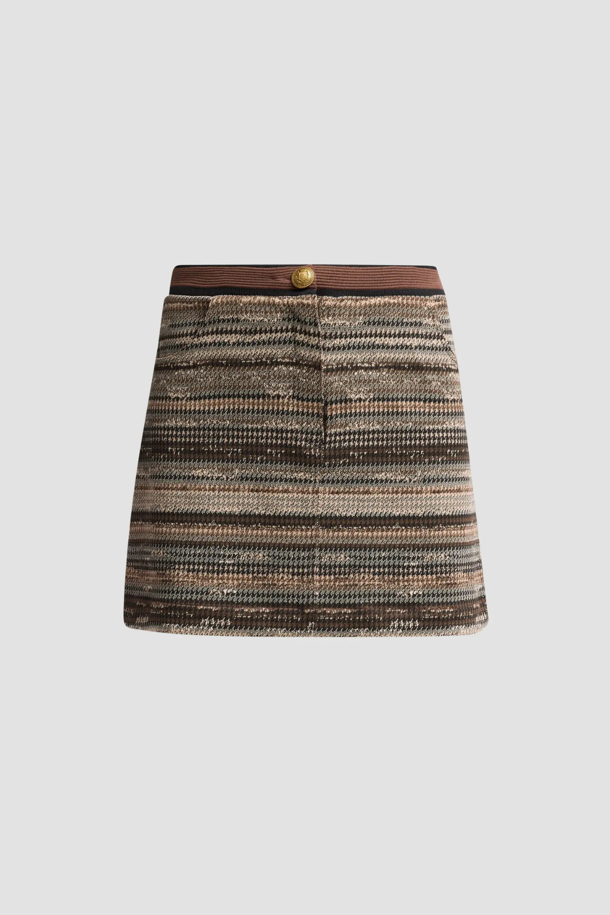 A mini skirt with a textured, woven horizontal stripe pattern in shades of brown, beige, and gray, featuring a contrasting dark brown waistband with a single gold button.