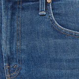 Close-up of blue denim jeans with a button and zipper detail.