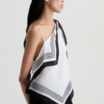 Model wearing a contemporary sleeveless printed top with a relaxed, flattering silhouette.