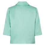 Mint green blazer on a white background