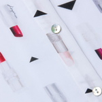 Lipstick patterned fabric with geometric shapes on a white background