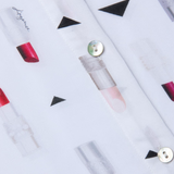 Lipstick patterned fabric with geometric shapes on a white background