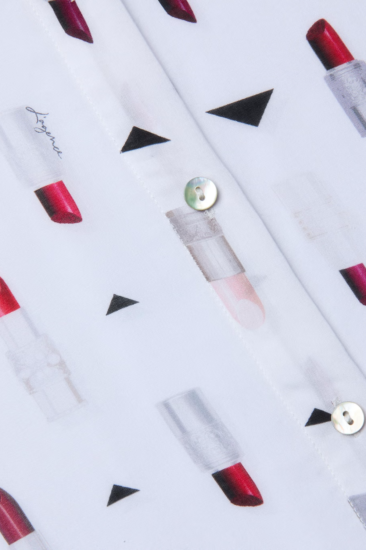 Lipstick patterned fabric with geometric shapes on a white background