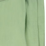 close up of green fabric shirt 