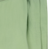 close up of green fabric shirt 