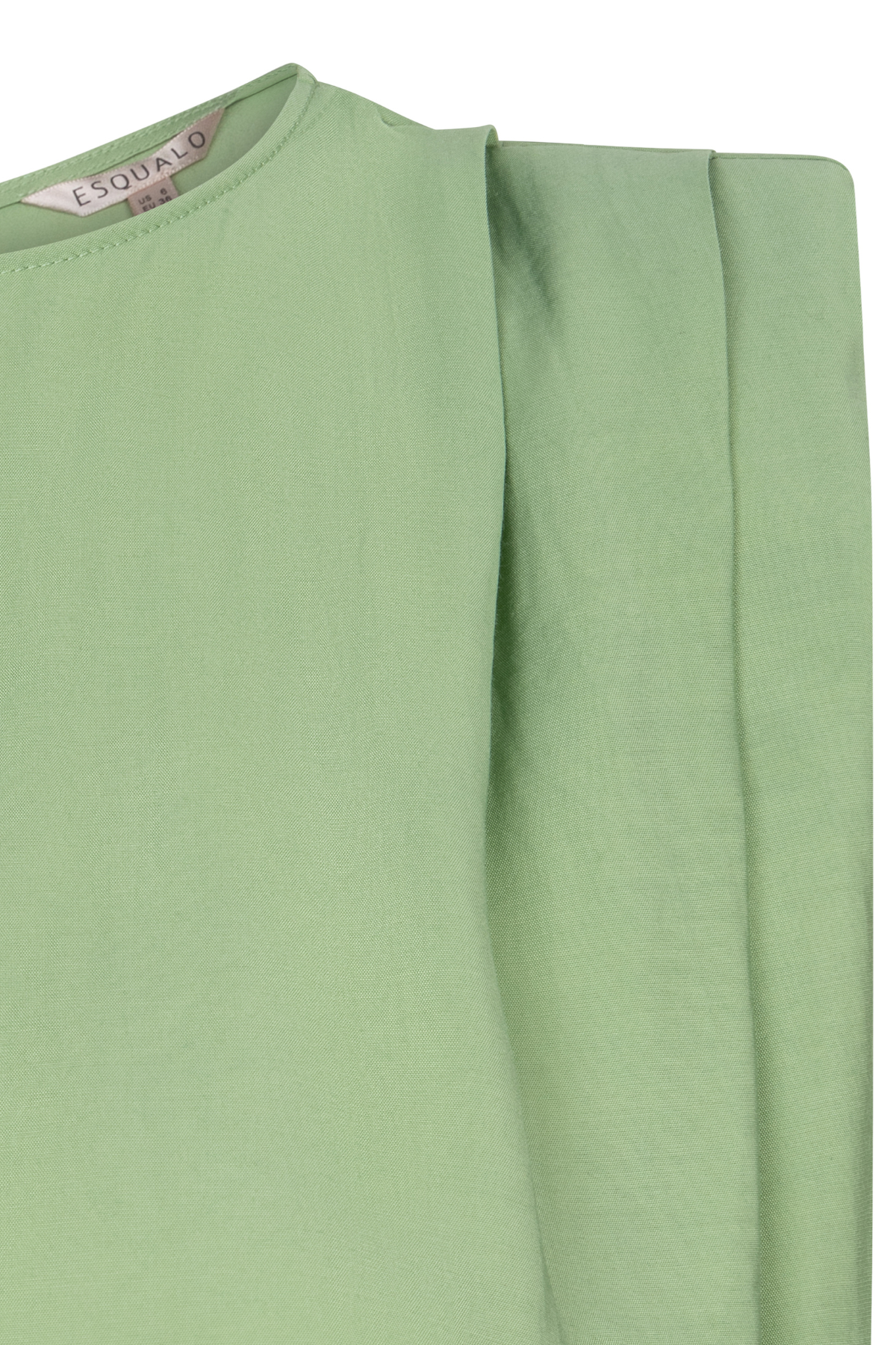close up of green fabric shirt 