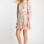 Woman wearing a floral dress on a white background