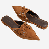 Women's flat shoe featuring a sleek, refined silhouette.