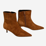 Women's brown textured ankle boot featuring a sleek silhouette and heel.