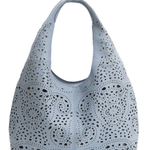 Light blue handbag with perforated design on a white background