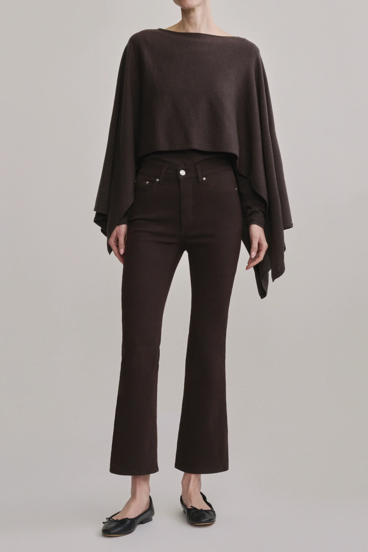 Women's dark-wash high-rise cropped bootcut jeans featuring a streamlined fit through the hip and thigh.