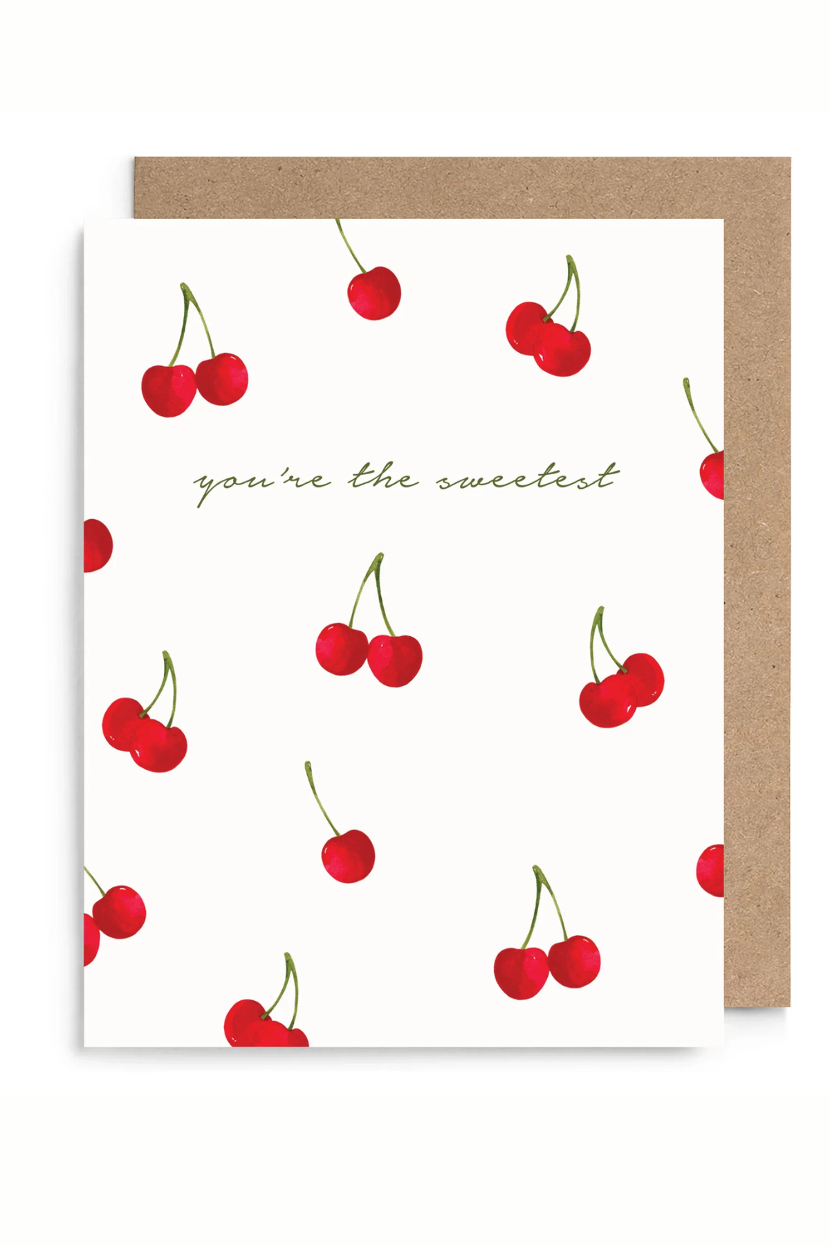 A white greeting card with a pattern of red cherries and the phrase 'you're the sweetest' in green script, shown with a brown kraft envelope behind it on a white background.