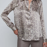 Long-sleeve blouse with a smooth, polished finish.