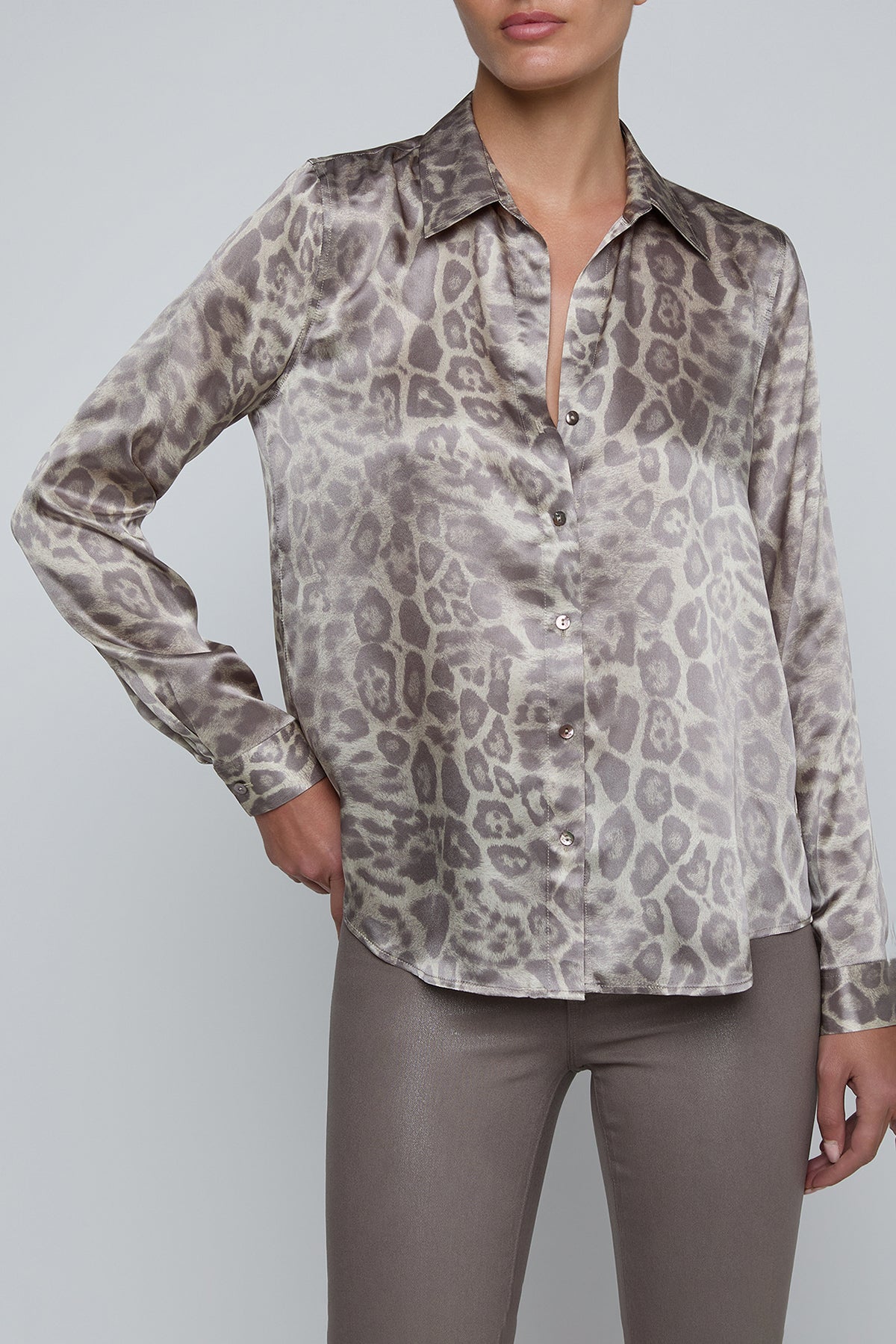 Long-sleeve blouse with a smooth, polished finish.