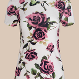 White t-shirt with pink rose floral pattern on a beige background