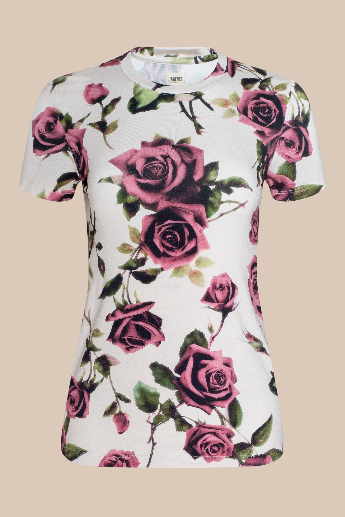 White t-shirt with pink rose floral pattern on a beige background