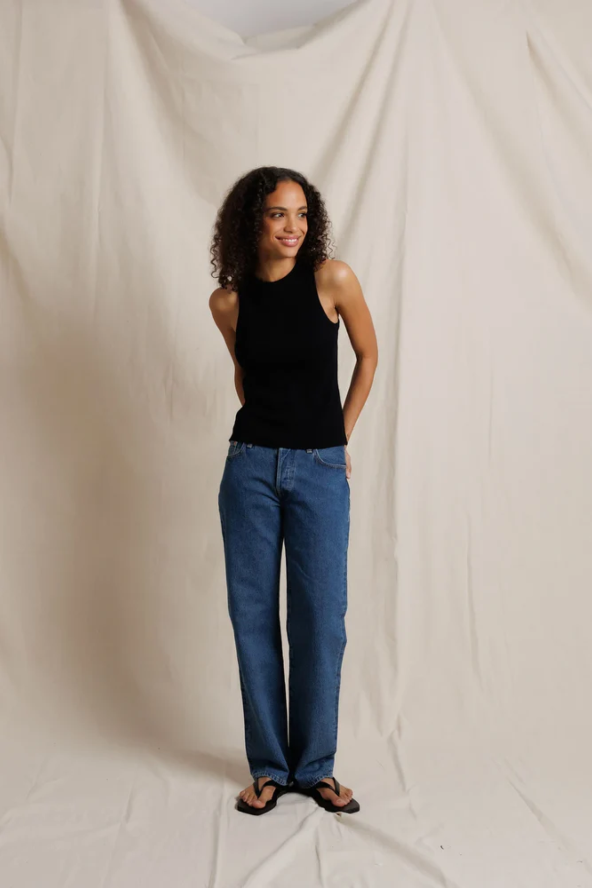 woman in black tank top and denim 