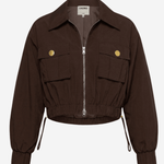 A dark brown cropped utility jacket with a front zipper, two flap pockets with gold-tone buttons, and drawstring details at the cuffs, shown on a light gray background.