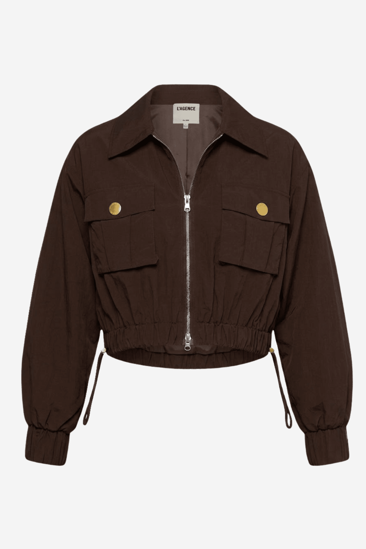 A dark brown cropped utility jacket with a front zipper, two flap pockets with gold-tone buttons, and drawstring details at the cuffs, shown on a light gray background.