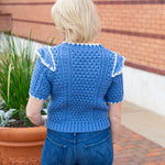 Short sleeve knit sweater with contrast embroidery detail