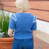 Short sleeve knit sweater with contrast embroidery detail