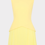 Yellow sleeveless dress with pleated skirt on a light gray background
