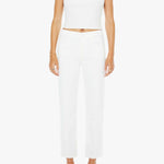 Woman wearing a white sleeveless top and pants on a white background